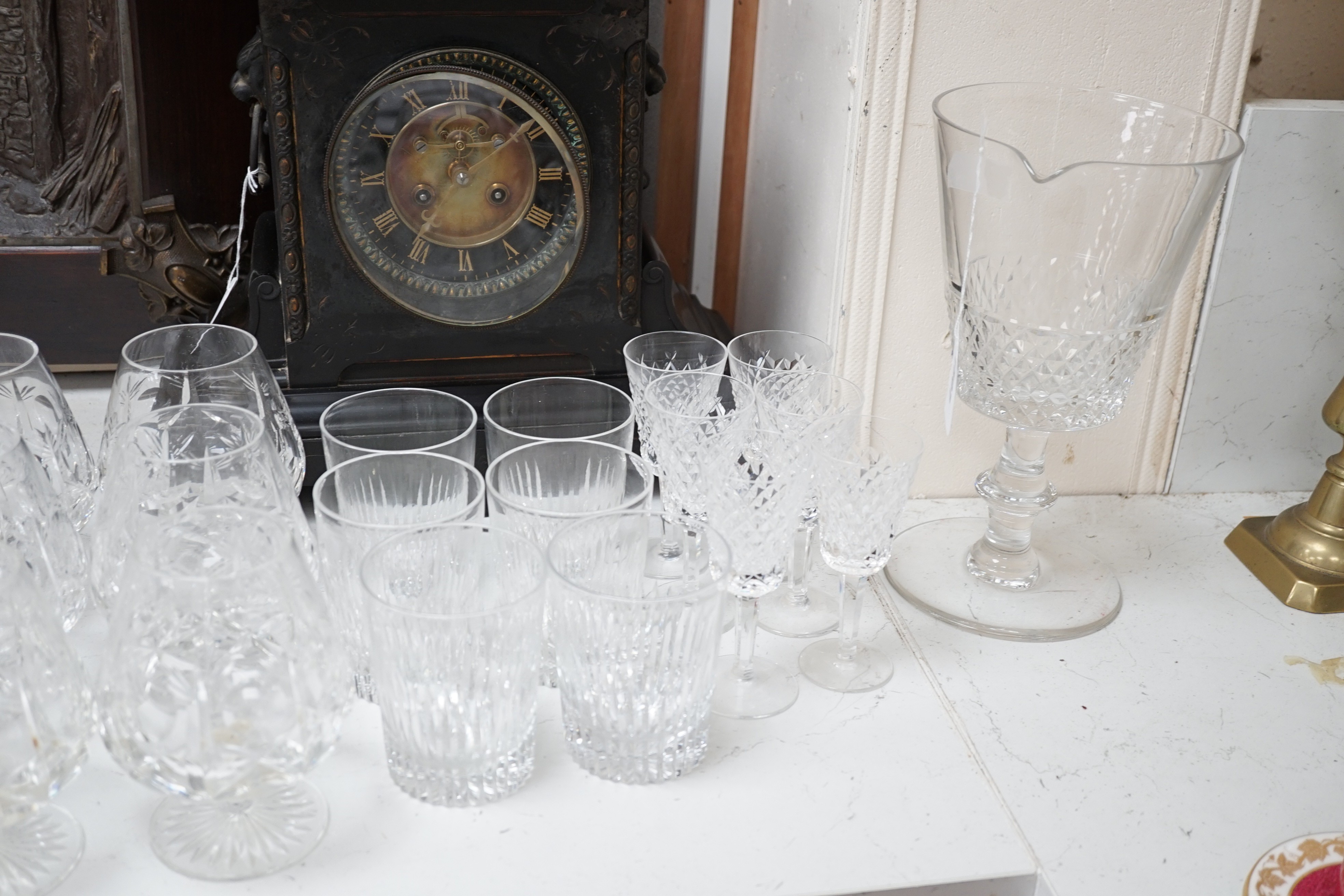 Assorted suites of cut glass wine glasses, brandy balloons, a pedestal water jug, two pedestal bowls